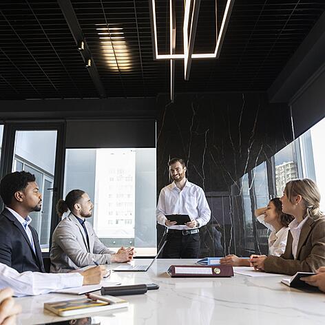 an image of a diverse group taking part in a business meeting